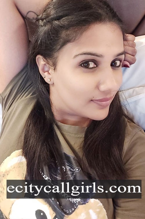 Jyothika in an olive t shirt lying down for a close up selfie, call girl in Electronic City Bangalore